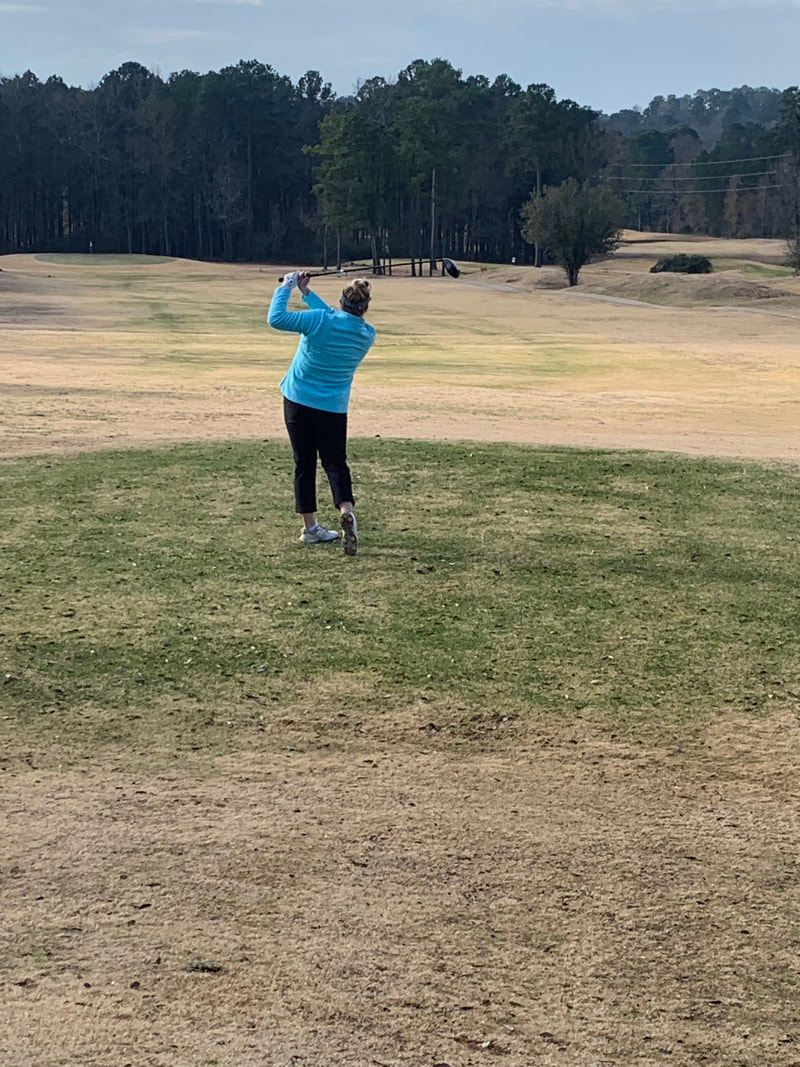 Emily Smith teeing off on hole 7 at Wood Hollow